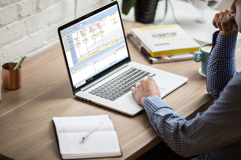 Person working on digital engineering program on laptop